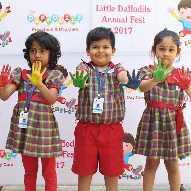 Toddlers smiling in class at Little Daffodils Preschool